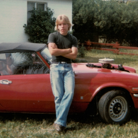 Robert standing near car that he rebuilt